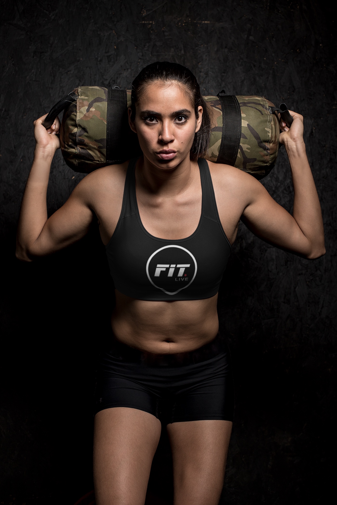 A FIT.LIVE athlete in branded kit, mid-session