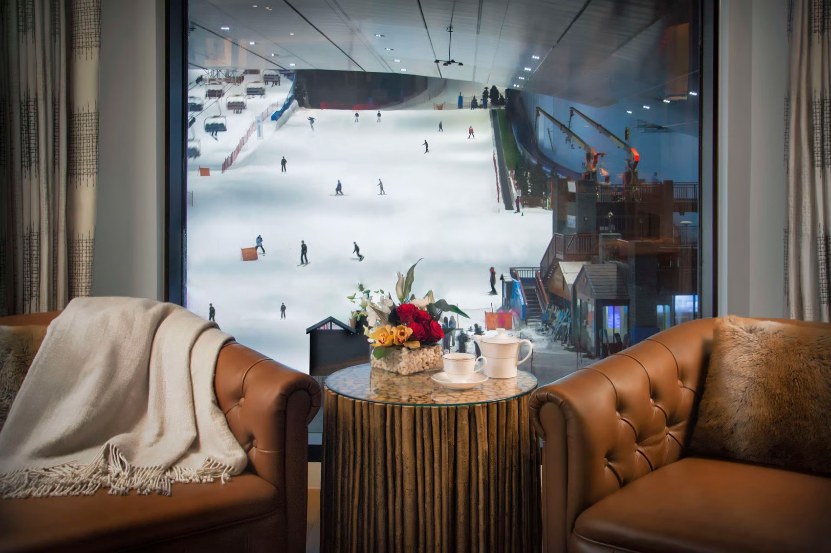 A Kempinski Aspen Ski Chalet suite overlooking the slope at Ski Dubai