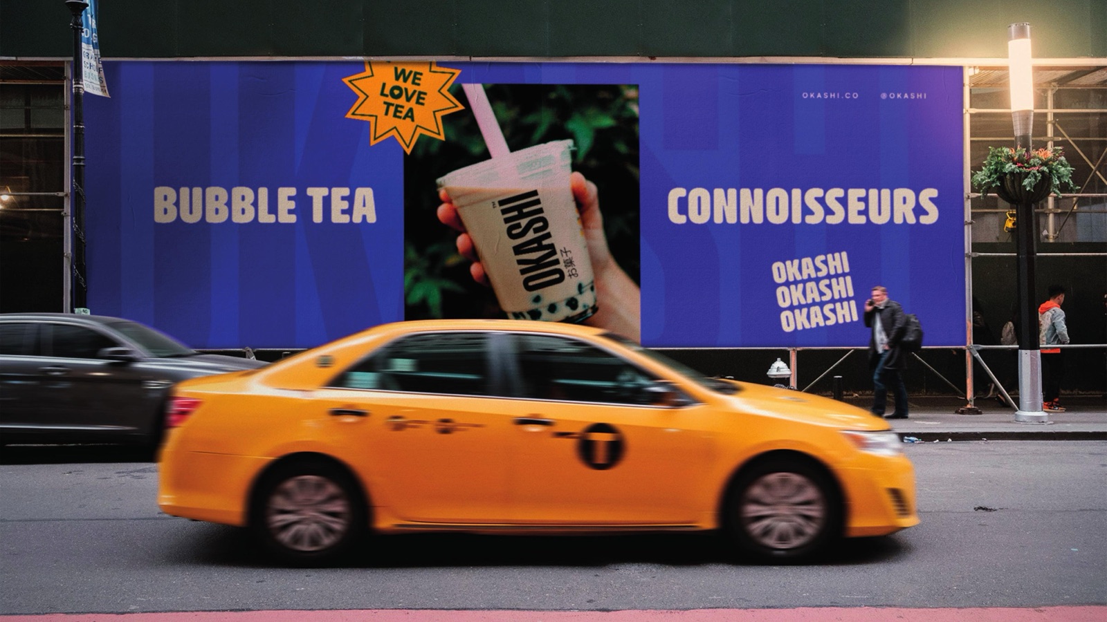 Okashi out of home advertising on a London taxi and hoarding