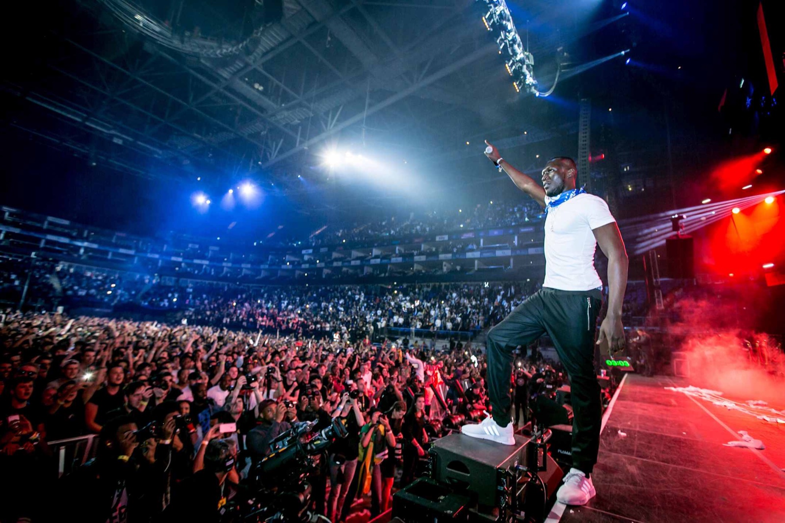 A packed arena crowd at a Red Bull event