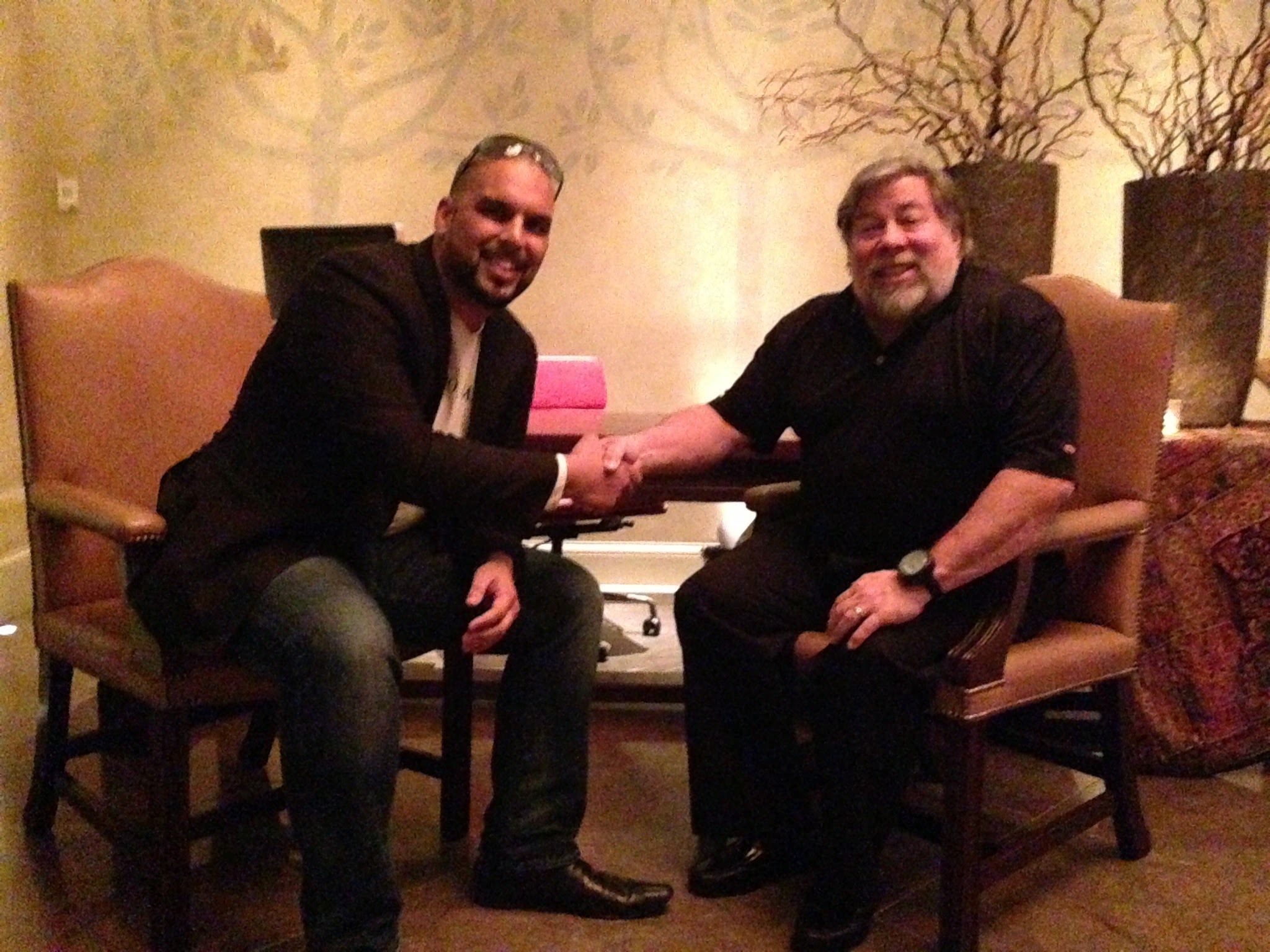 AJ Joshi, Ikaroa founder, shaking hands with Steve Wozniak, co-founder of Apple